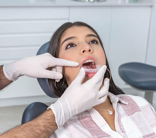 Stomatologist Fitting Dental Aligners
